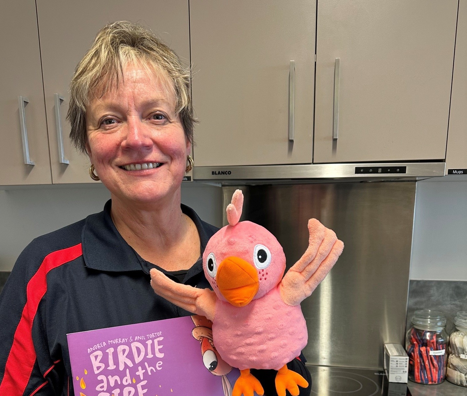 Adele Buchanan uses the Birdie and the fire book and puppet with some of the playgroups